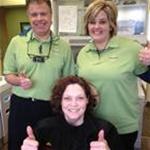 Dr. Mark Just, Alaska DDS Volunteer, and Melissa White, dental assistant, with Rhonda (seated), D​ental Lifeline patient.